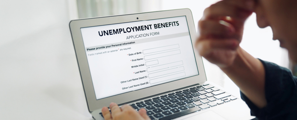 filing an unemployment claim on a laptop