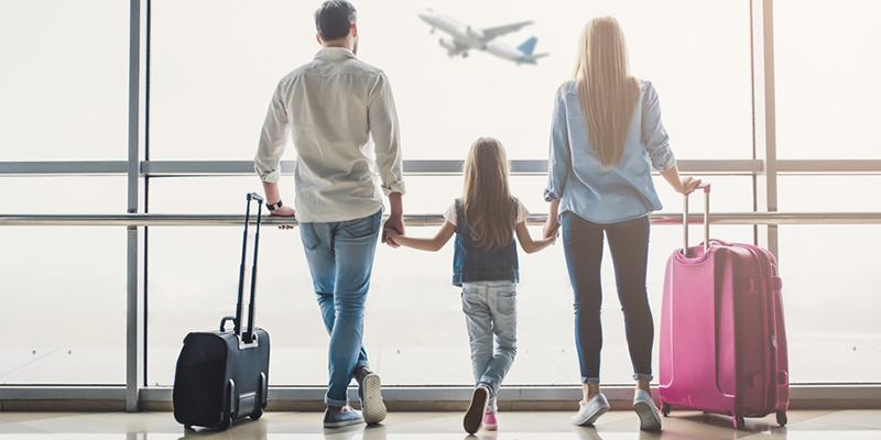 family at airport concerned about vacation scams